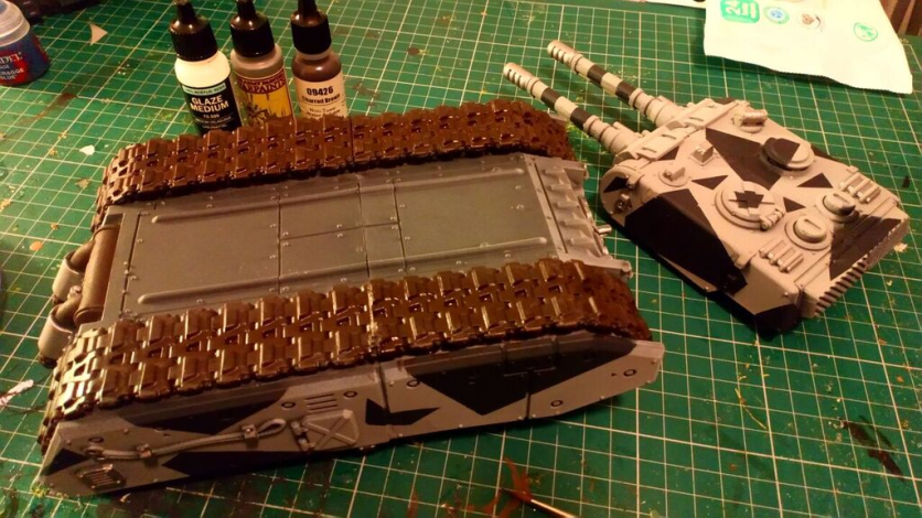 A dark brown (mixed with a couple of drops of glaze medium) was brushed onto the tracks, prior to a silver drybrush